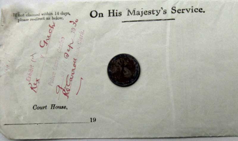 Envelope containing Exhibit “1” – a shilling. Photo: Peter de Waal